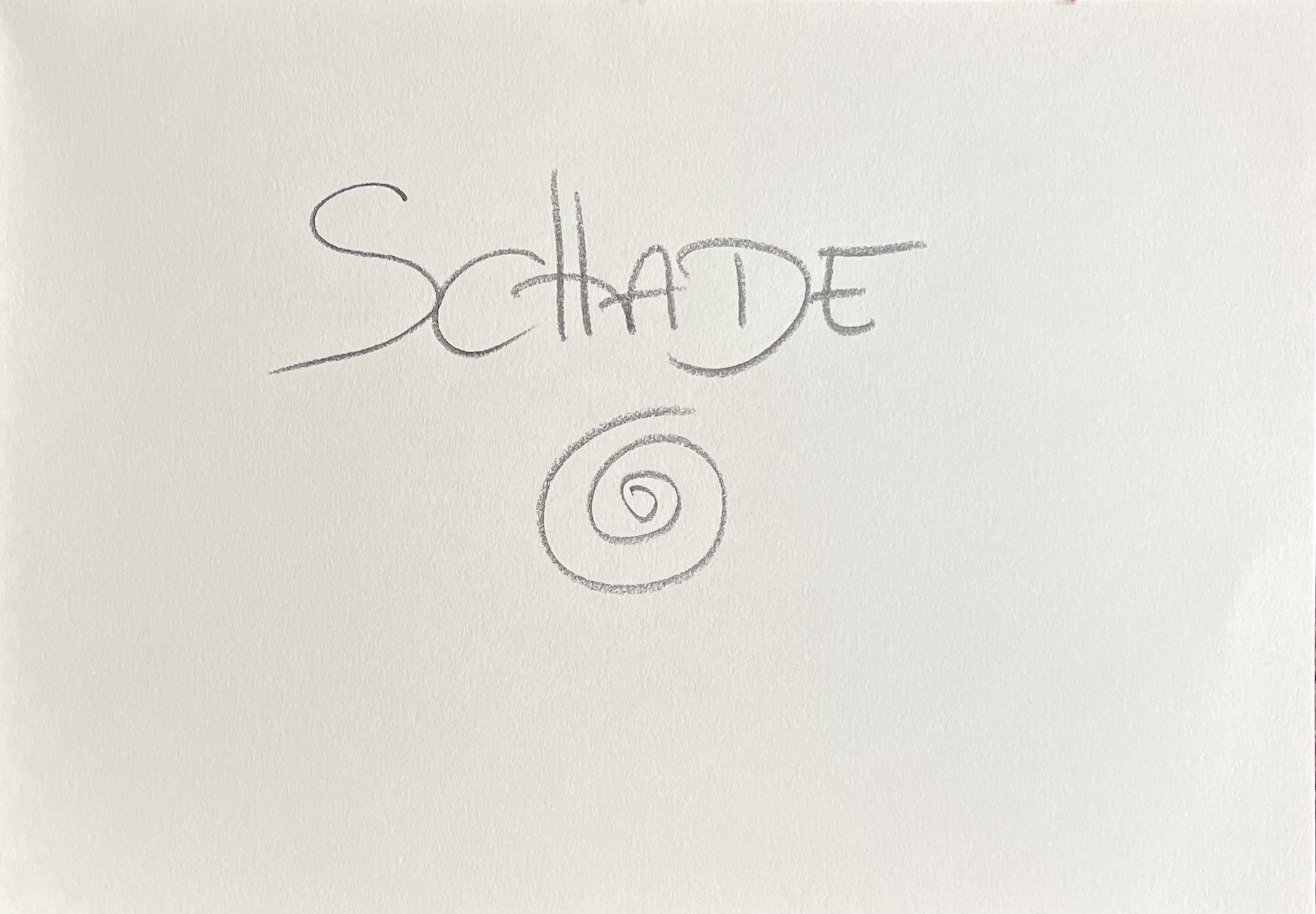 weißer Hintergrund, mit Bleistift das Wort "Schade" und eine Spirale